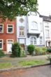 Vorderansicht - Blick ins Grüne: 2-Zimmer-Wohnung mit großer Sonnenterasse!