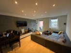 Wohnzimmer - Eigentumswohnung im 1.OG mit Terrasse und Garage in beliebter Lage.