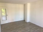 Wohnzimmer - Topp Zustand! Sehr gepflegtes Mehrfamilienhaus mit Arztpraxis und drei Garagen. Komplett vermietet!